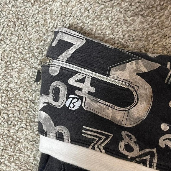 black and white foldover shorts w/ numerical pattern and zipper pocket - Picture 3 of 6